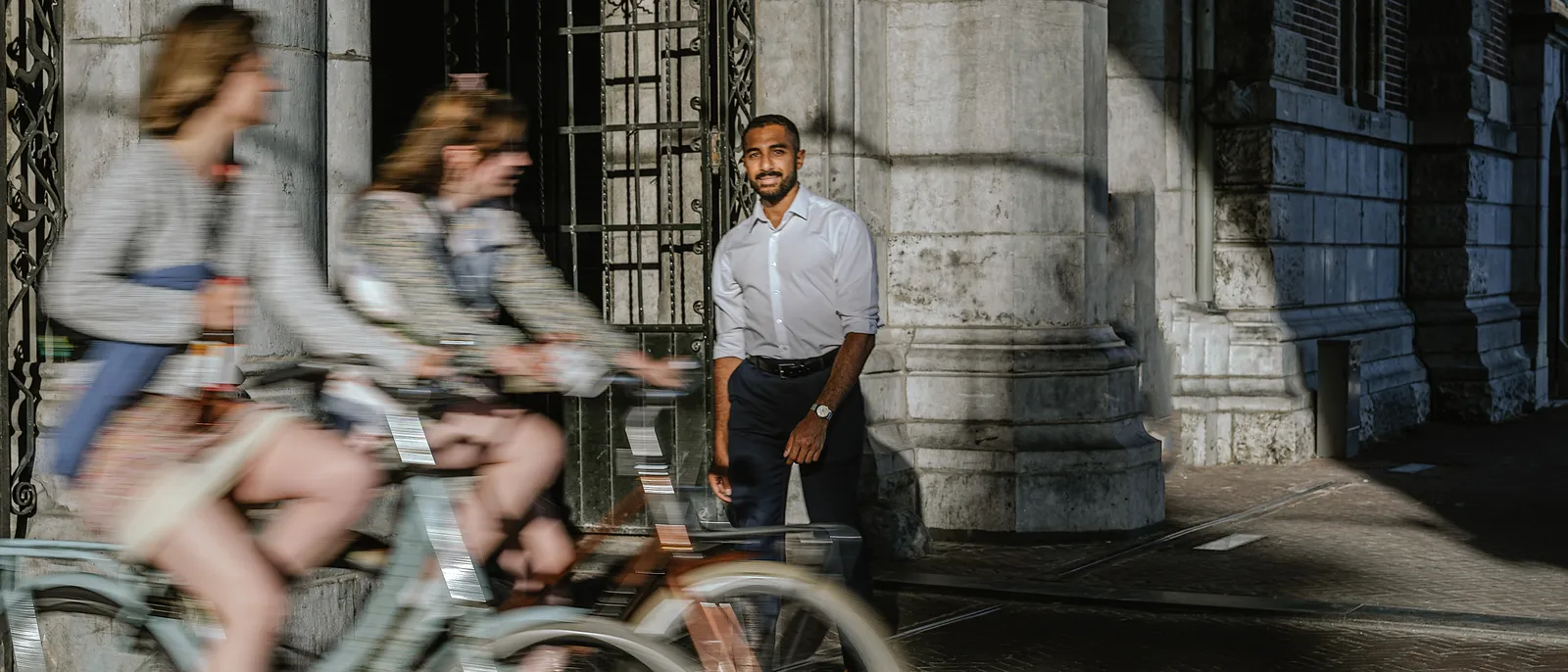 Amsterdam street scene with Amr Alassal at a church portal